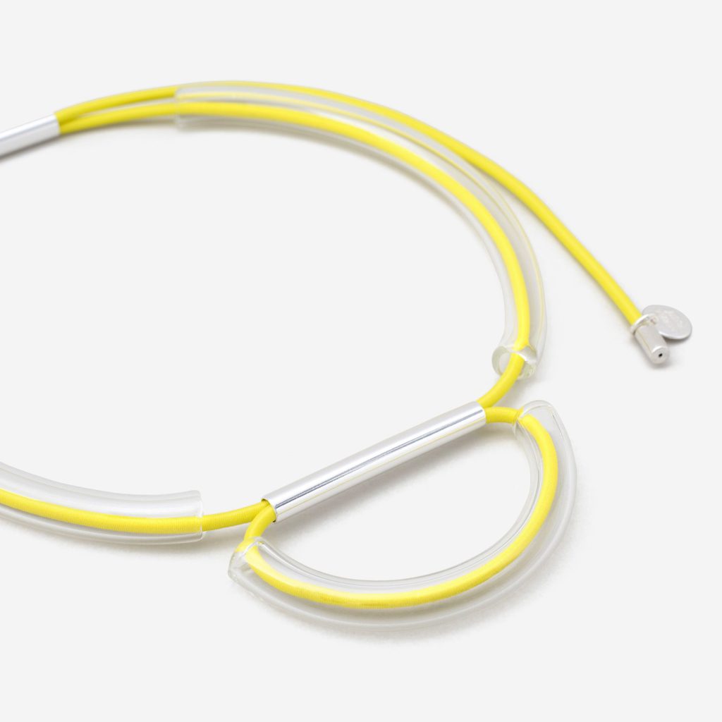 Necklace with yellow strings and crystal structures