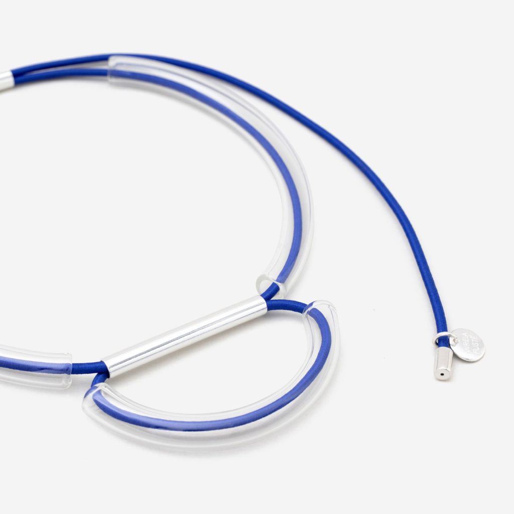 Necklace with blue strings and crystal structures